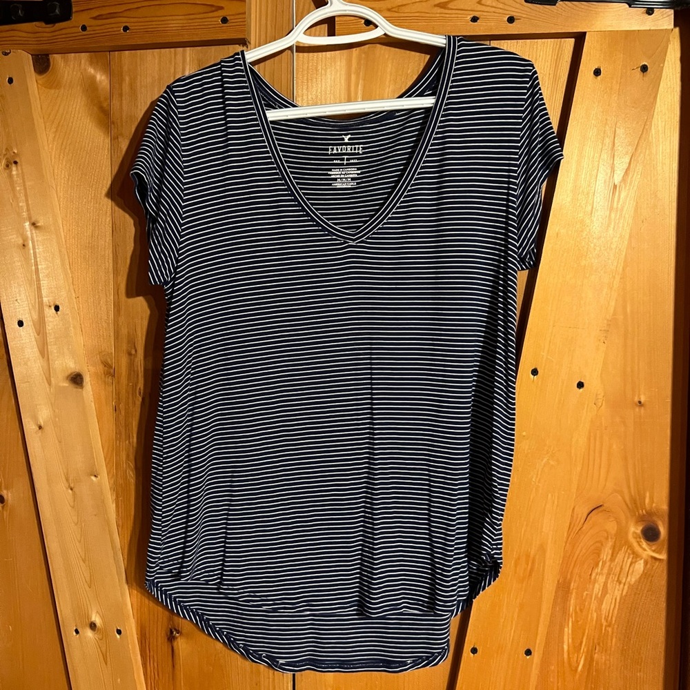 Navy blue and white striped tee.